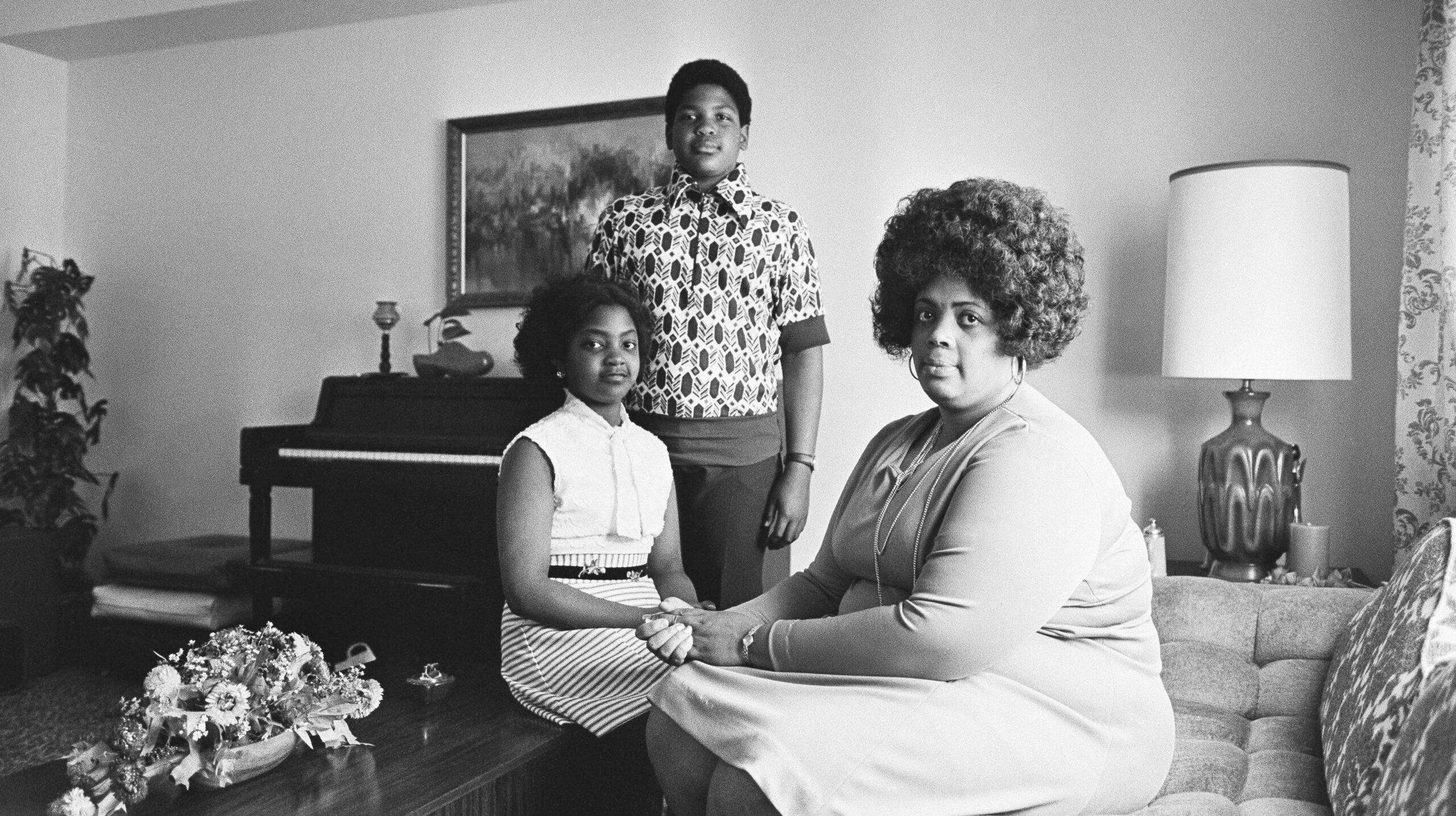 In this April 30, 1974, file photo, Linda Brown, right, and her two children pose for a photo in their home in Topeka, Kan. Brown, the Kansas girl at the center of the 1954 U.S. Supreme Court ruling that struck down racial segregation in schools, has died at age 75. Peaceful Rest Funeral Chapel of Topeka confirmed that Linda Brown died Sunday, March 25, 2018. - Associated Press