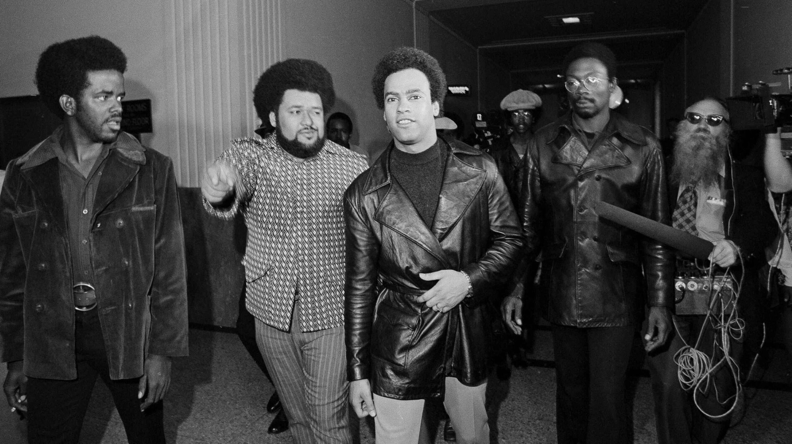 In this Oct. 13, 1971, file photo, accompanied by his bodyguard, Robert Leonard Bay, left, Huey Newton, co-founder of the Black Panther Party, leaves the Alameda County Courthouse, after his third trial in connection with the death of a policeman. John Frey, an Oakland police officer who died of gunshot wounds in 1967 after pulling Newton over. Newton denied shooting Frey but was convicted of voluntary manslaughter in 1968 Newton's conviction, but was overturned two years later. The case spurred a "Free Huey" campaign. (AP Photo/Rusty Kennedy, File) - Associated Press
