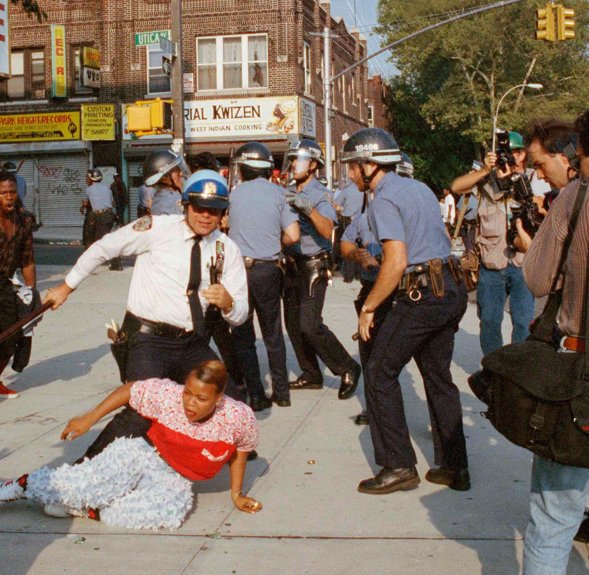 New York City police officers scuffle with a protestor during a march through the Crown Heights section of Brooklyn, Aug. 21, 1991. Confrontations between police and protestors marked the third day of violence sparked by a car accident Monday night that left a 7-year-old black child dead and a Hasidic man stabbed to death in the melee that followed. (AP Photo/Joe Major) - Associated Press