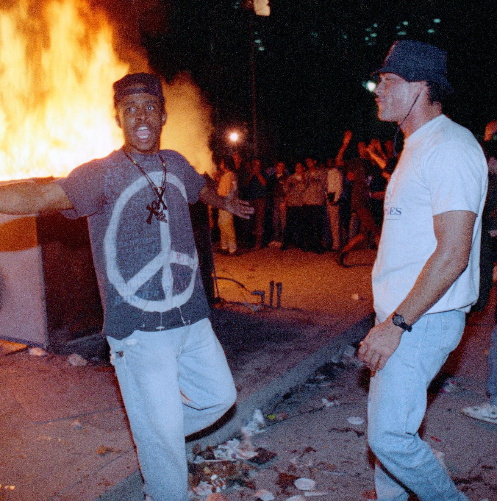 In this April 29, 1992 file photo, demonstrators protest the verdict in the Rodney King beating case in front of the Los Angeles Police Department headquarters in Los Angeles. When violent protests over the death of George Floyd reached Los Angeles, people of color expressed heartbreak but not necessarily surprise. They had seen it nearly 30 years ago when riots rocked the city after four white police officers were acquitted of charges in the beating of black driver King. (AP Photo/Nick Ut, File) - Associated Press