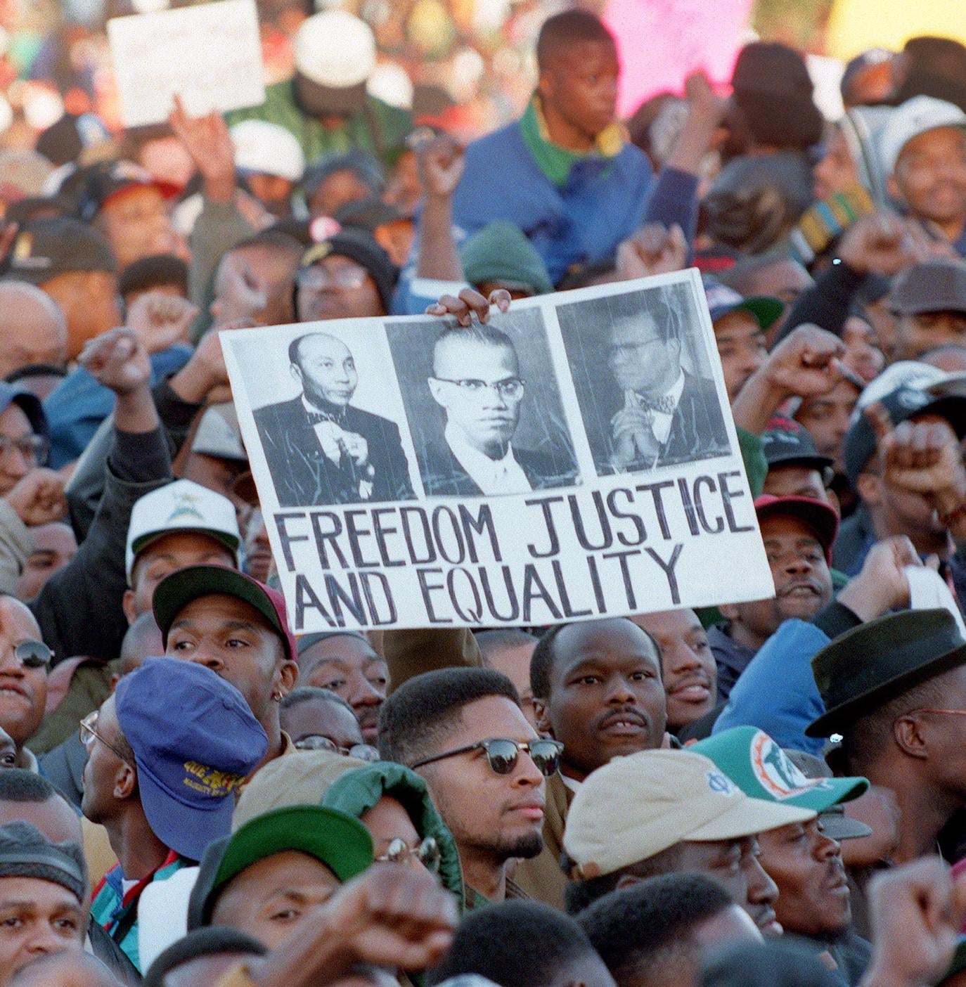 Thousands of people gather on the Mall in front of the US Capitol during the "Million Man March" in Washington D.C., 16 October 1995. The march, called by Nation of Islam leader Louis Farrakhan, is intended as a day for back men to unite and pledge self-reliance and commitment to their families and communities. (Photo credit should read TIM SLOAN/AFP via Getty Images) - Getty Images