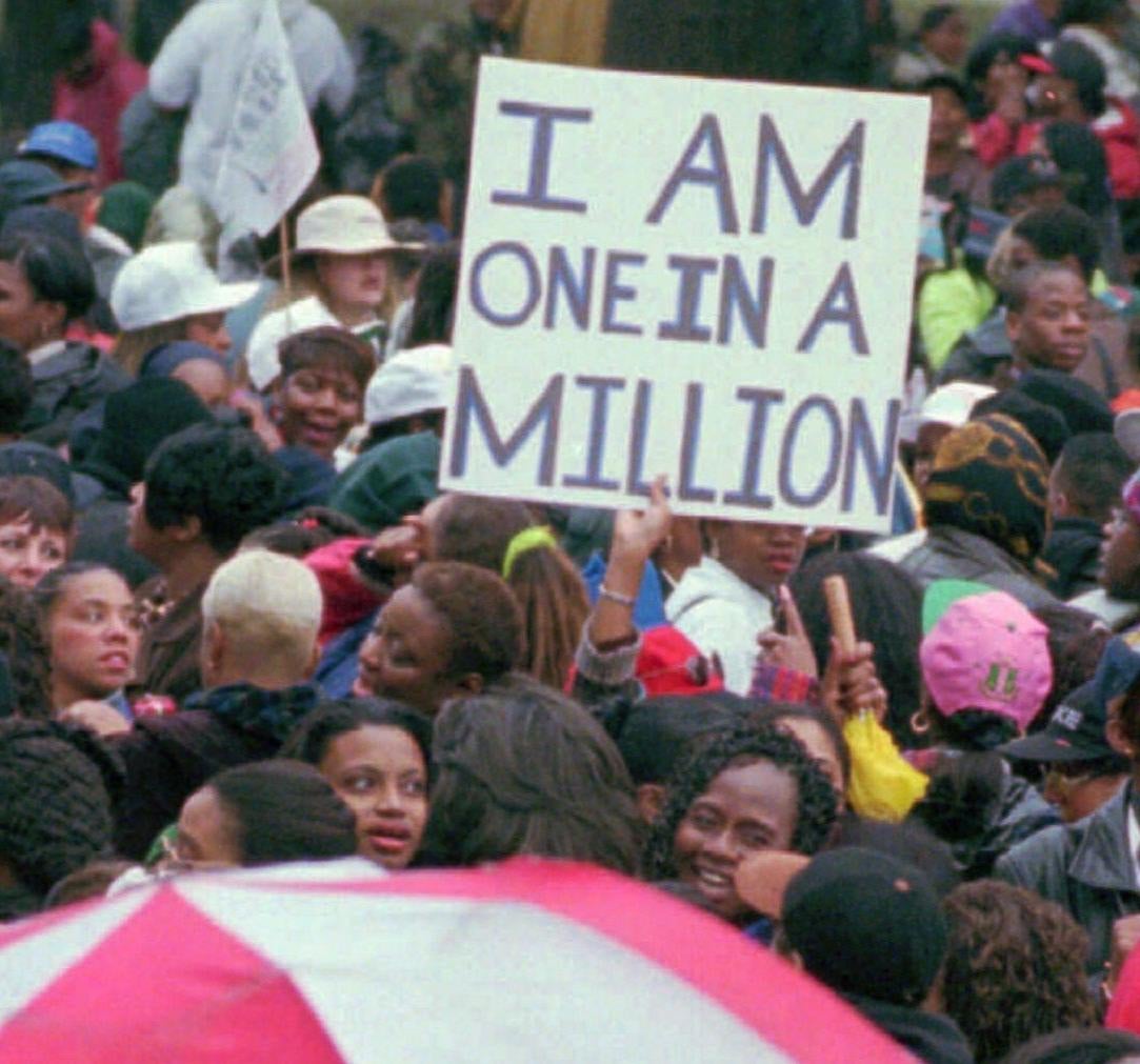 A lone sign is seen above the crowd during the Million Woman March in Philadelphia Saturday, Oct. 25, 1997. City officials have prepared for up to 700,000 women to attend the daylong event, which will focus on ``repentance, resurrection and restoration.’’ (AP Photo/Chris Gardner) - Associated Press