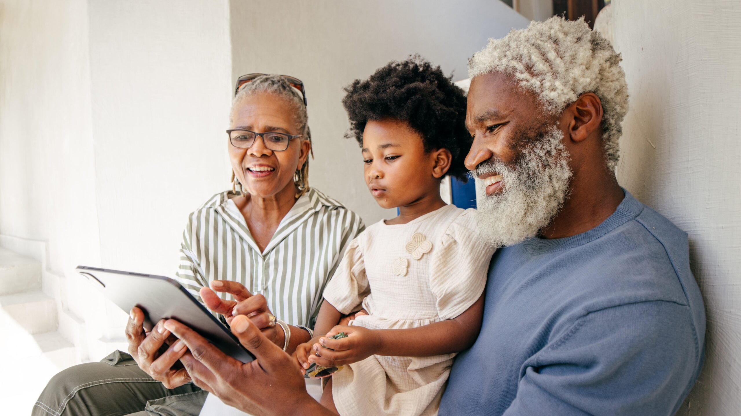 Grandfather, grandmother reading to their grandchild Photo: Getty Images Getty Images