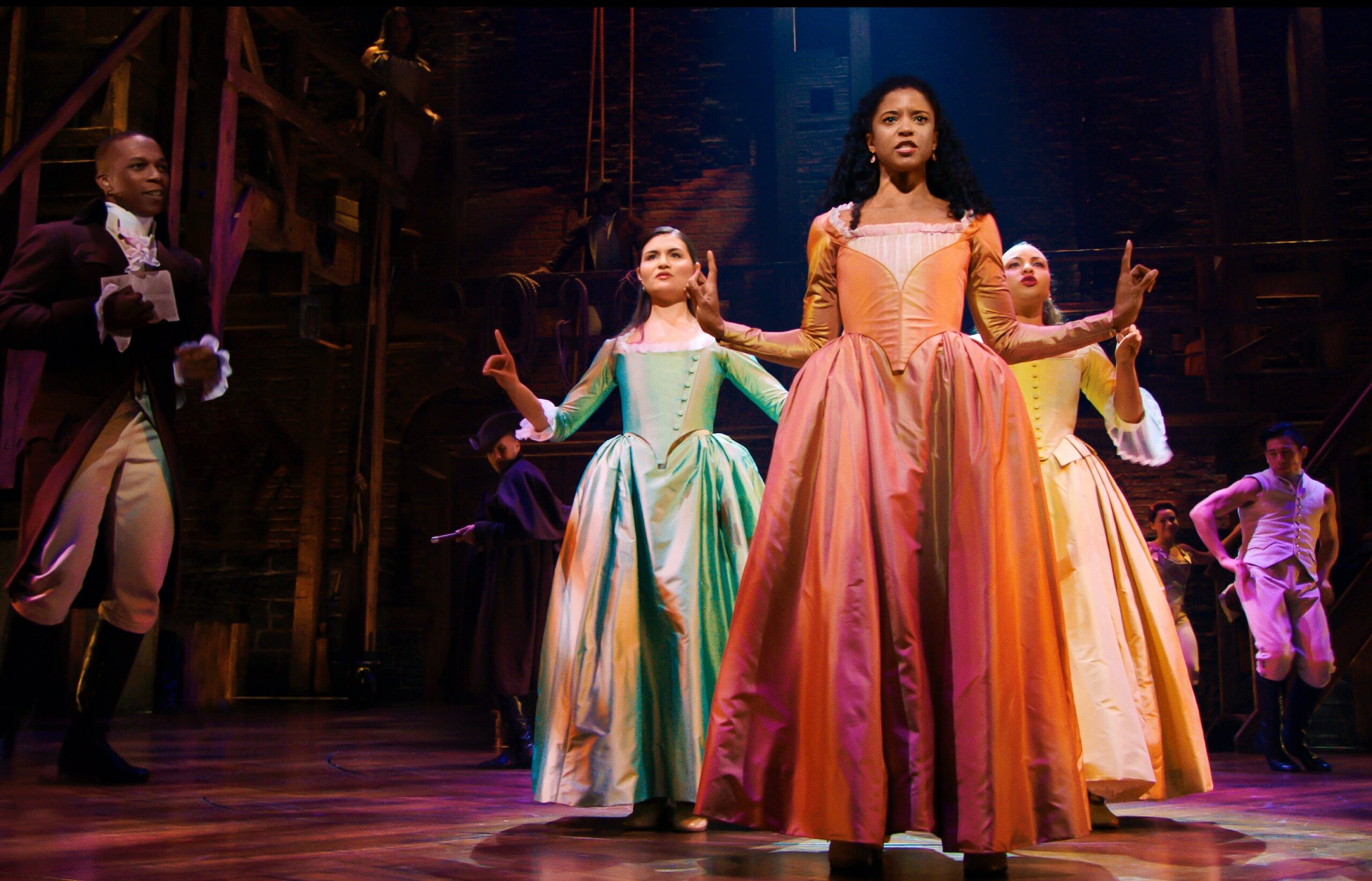 Phillipa Soo is Eliza Hamilton, Renée Elise Goldsberry is Angelica Schuyler and Jasmine Cephas Jones is Peggy Schuyler in HAMILTON, the filmed version of the original Broadway production. Photo: Disney+