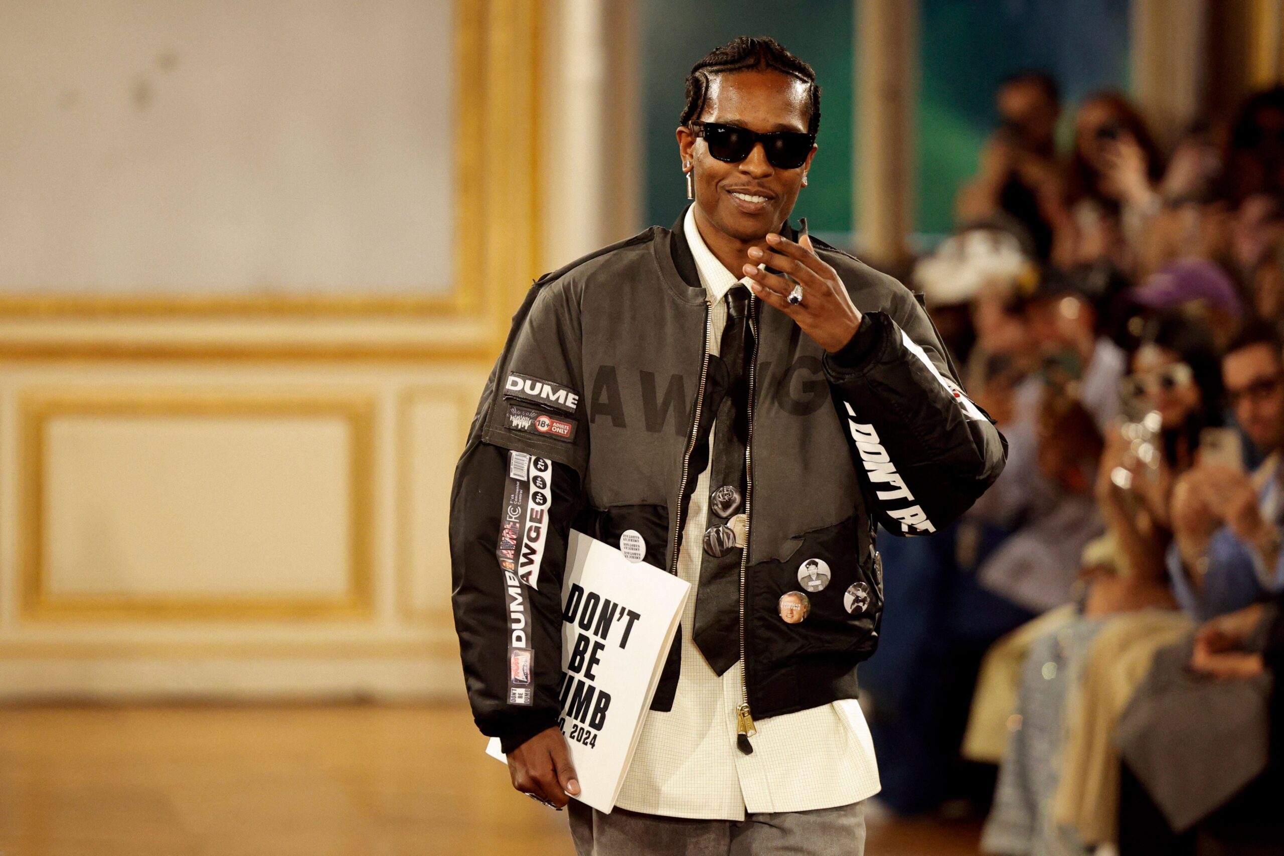 US rapper and designer ASAP Rocky aknowledges the audience at the end of the American Sabotage AWGE Spring/Summer 2025 menswear ready to wear collection show as part of Paris Fashion Week in Paris, on June 21, 2024. Photo: Getty Images GEOFFROY VAN DER HASSELT