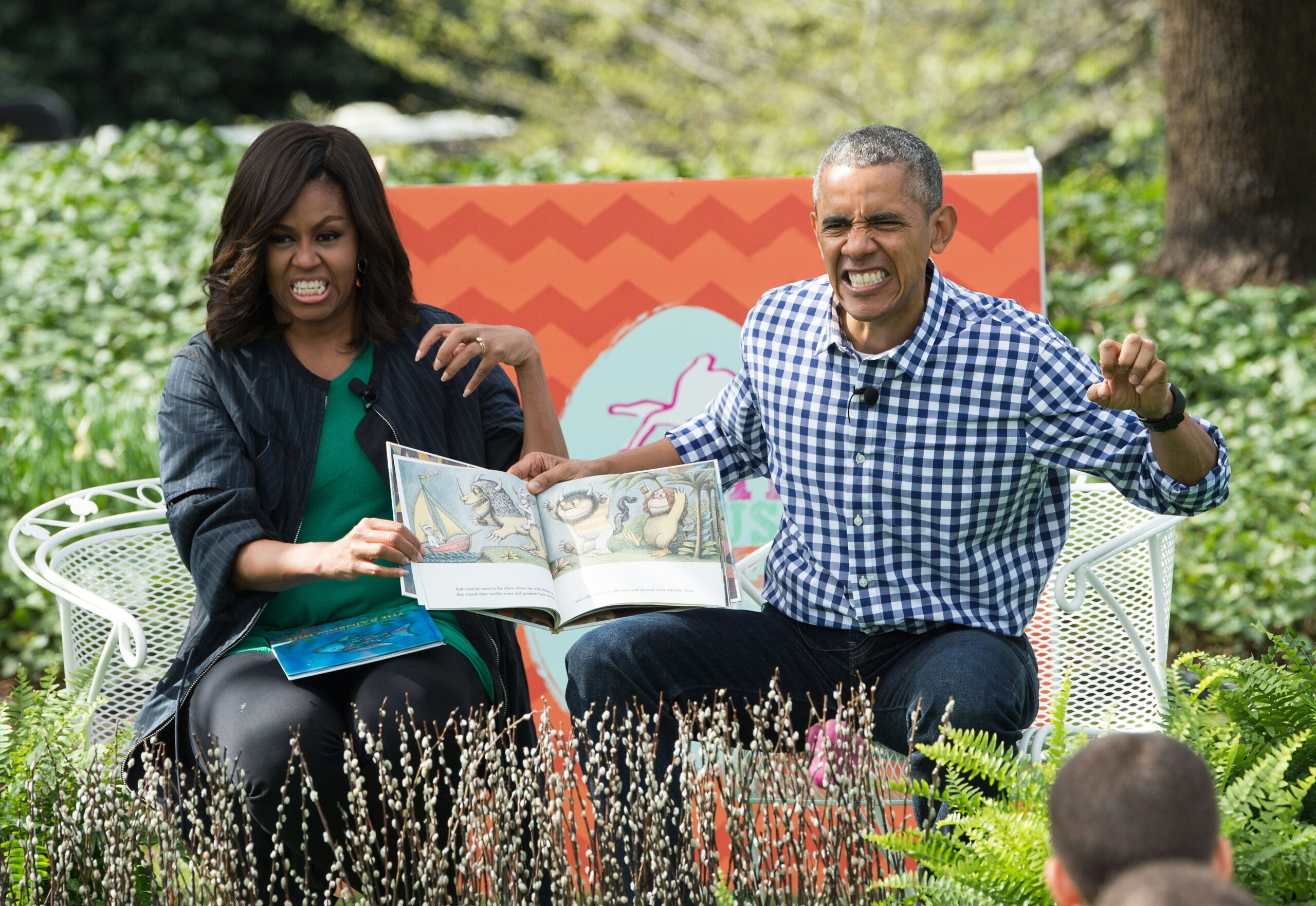 US President Barack Obama and First Lady Michelle Obama read Maurice Sendak’s “Where the Wild Things Are” to children at the annual Easter Egg Roll at the White House in Washington, DC, on March 28, 2016. Photo: Getty Images NICHOLAS KAMM/AFP