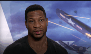 ‘He’s A Hero of Mine’: Jonathan Majors Reflects on Portraying A Real-Life Black Naval Aviator in Devotion