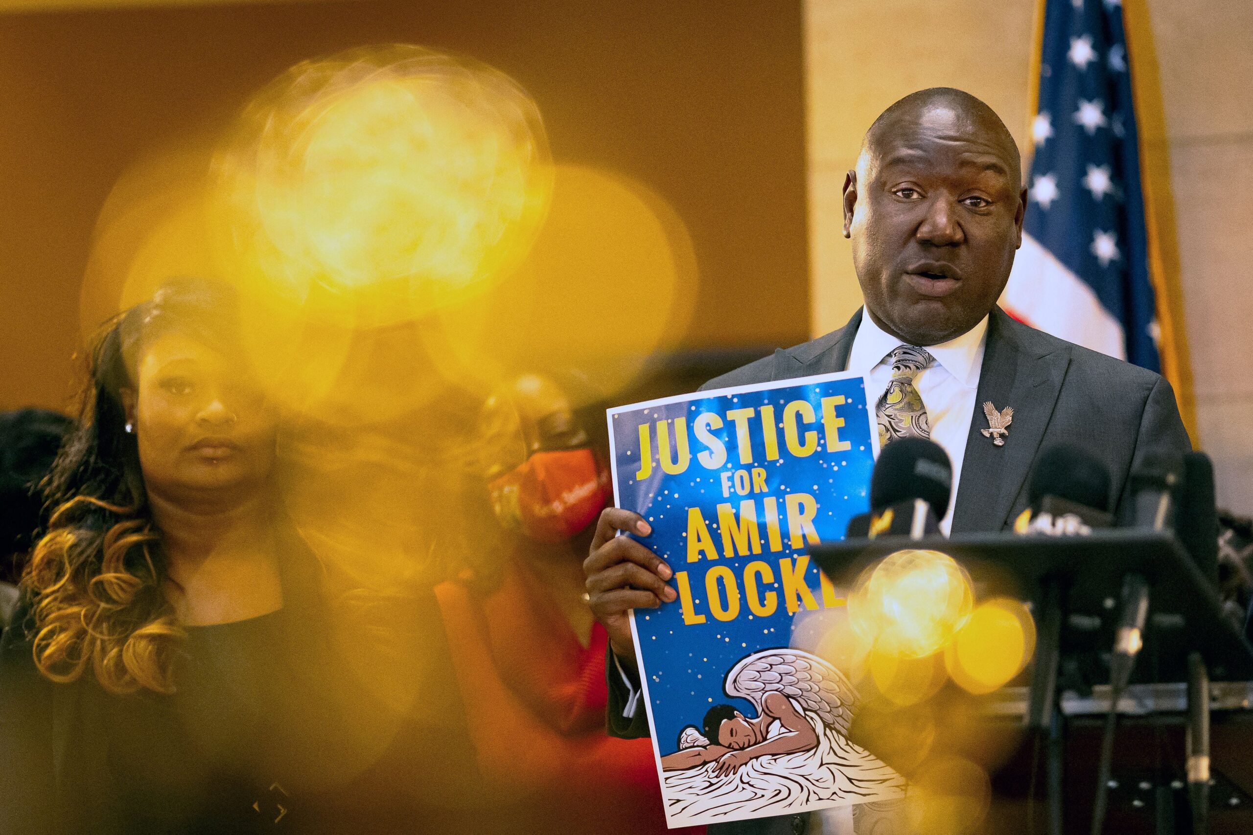 Civil rights attorney Ben Crump (R) holds a sign reading “Justice for Amir Locke” during a news conference with families who lost their loved ones to police violence to demand the abolishment of no-knock warrants and justice for the victims at the Minnesota State Capitol in Saint Paul, Minnesota on February 10, 2022. (Photo by Kerem Yucel / AFP) (Photo by KEREM YUCEL/AFP via Getty Images) Photo: Getty Images Kerem Yucel