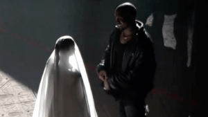 Trolling With the Kardashians? Kanye and Kim Seemingly Reenact Wedding at Chicago Donda Event
