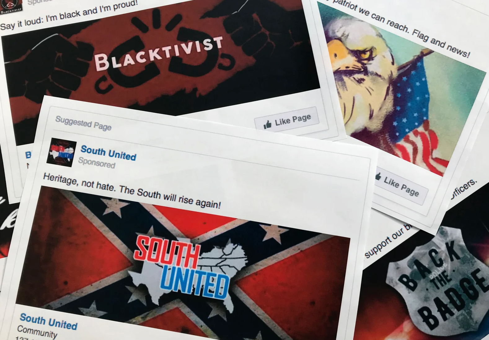 Some of the Facebook ads linked to a Russian effort to disrupt the American political process and stir up tensions around divisive social issues, released by members of the U.S. House Intelligence committee, are photographed in Washington. Photo: AP Photo Jon Elswick